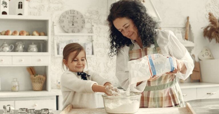 Mother and daughter baking in a cozy kitchen, creating warm memories together.